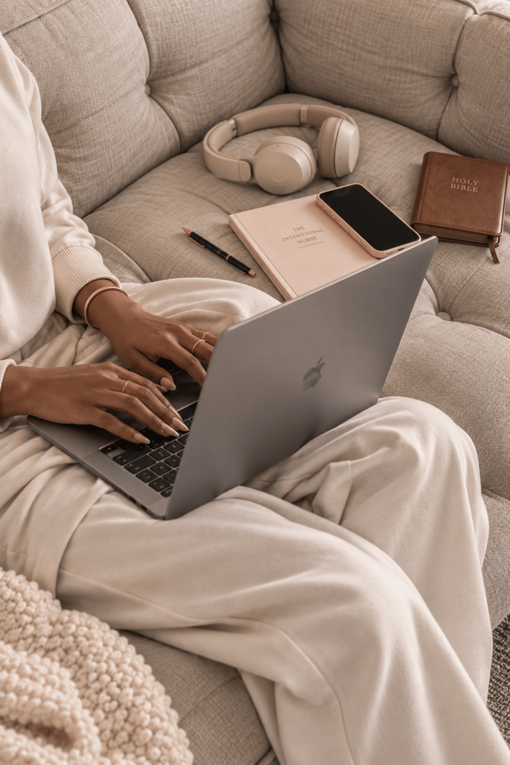 Nurse working from home on a laptop while exploring remote nursing jobs.
